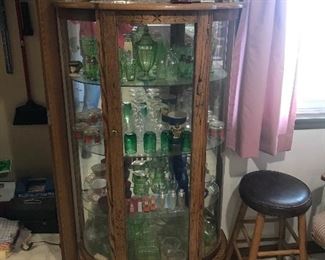 china cabinet, (not antique) w/ lots of glassware.