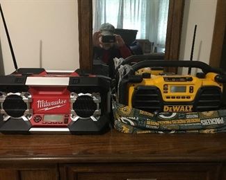 Milwaukee and DeWalt radios, note the DeWalt has a Packer cover.