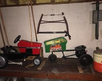 Here are 2 of the three pedal tractors... Case International and the Power Trac, the John Deere and cart are NOT pictured. NOTE the Aliss Chalmers - AC 5 gal oil can!!!