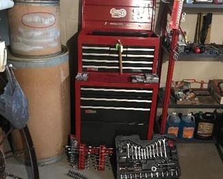 Craftsman Tool Bench with various wrench sets in front.