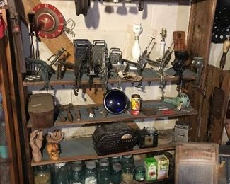 Various seed pitters, halloween hands, hand tools, canning jars, insultors, the second Jefferson City snow plow colored lights, a vintage Fort Atkinson sign.