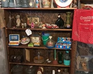 more various odds and ends all in a pie cabinet 