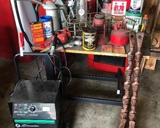 This pic is full of oil/gas items: MOBILE OIL BOTTLES w/ funnels, oil 8 count oil bottle carrier, Quaker grease can (full), 5 gallon Midland can,   copper coated funnel, (upfront middle) is a Harley Davidson can, Schumacker starter/charger and more. We even brought the fork & spoon!!