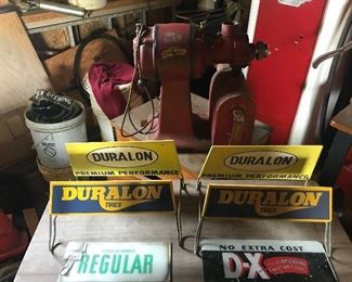 A couple of Duralon Tire holders, Standard coffee grinder, the foreground shows two glass gas pump inserts.