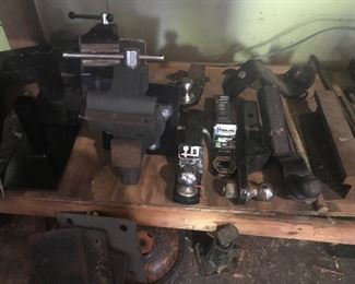 a variety of vises and trailer hitches/balls
