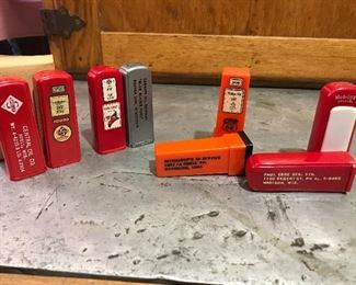Circa 1950s gas pump salt and pepper shakers. All four are being promoted by their local Service station with town and phone number.