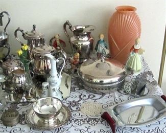Close up of silver plate and decorative items