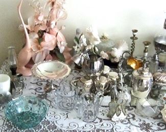Close up of silver plate and decorative items