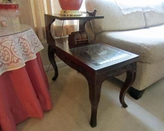 One of a pair of carved top end tables