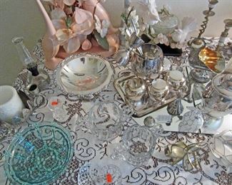 Close up of silver plate and decorative items