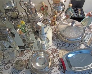 Close up of silver plate and decorative items