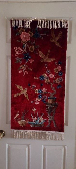 Small red silk rug