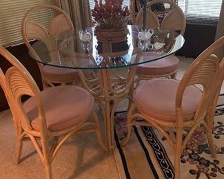 Rattan & glass top dining set with 4 chairs. 