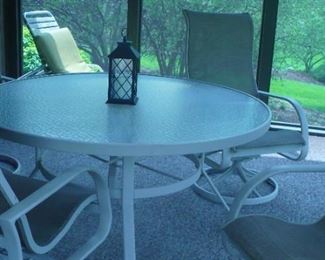   PATIO SET WITH 4 CHAIRS. TABLE AND LOUNGE.                                                  