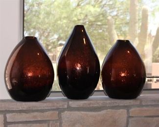 Blown glass vases with copper elements