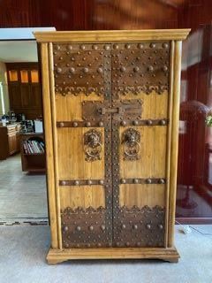 Incredible Wood Armoire with Iron Accents. Great storage inside with drawers and shelves. 
