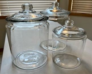 Large glass covered jars