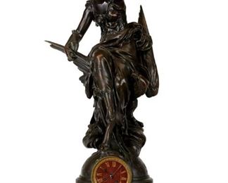 A French Bronze and Rouge Marble Figural Clock