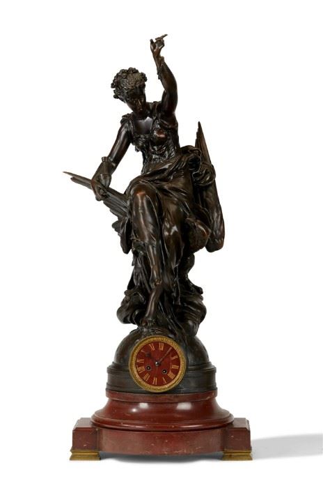 A French Bronze and Rouge Marble Figural Clock