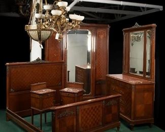 A Louis XVI-style inlaid bedroom set