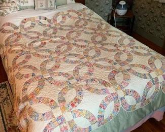 Primary Bedroom 
Double Wedding Ring Quilt-1920’s w/ note of maker and date 