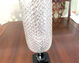 Cut glass candle holder of black glass pedestal