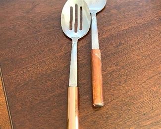 Stainless kitchen spoons with copper handles