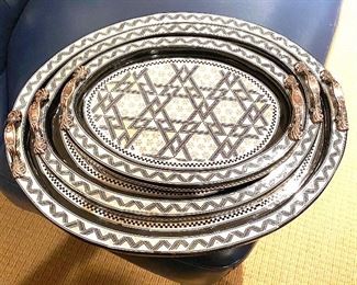 Set of stacking lacquered serving trays