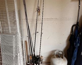 wire shelving, fishing poles, propane tank, umbrellas