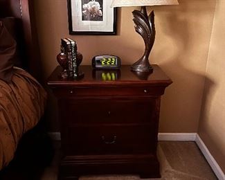 Thomasville night stand, books and book end, clock radio, lamp, floral picture