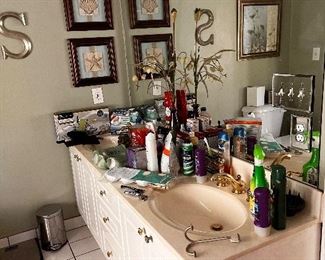 scale, trash can, pictures, wall art, toiletries