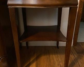 Vintage accent table with wheeled legs