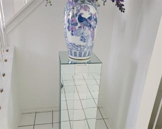 MIRRORED PEDISTAL (REFLECTION OF FLOOR TILES CREATES ILLUSION OF CHIP BUT NO CHIPS .)VASE NOT AVAIABLE