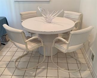 LAMINATE TABLE AND FOUR CHAIRS. DISCOLLORATION IN PHOTO ONLY