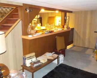 Full basement bar with vintage glassware, decor and swag !!