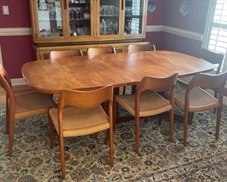 Incredible Mid-century modern Danish table with eight chairs. Includes two leafs. Don’t miss this!