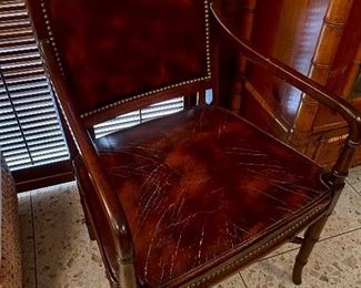 pair of antique leather arm chairs