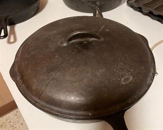 Large cast iron skillet with lid