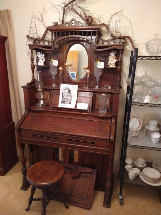 antique pump organ with stool
