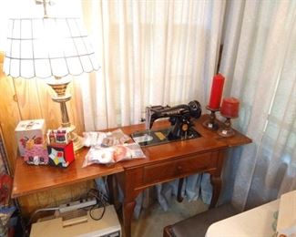 antique singer sewing machine in cabinet