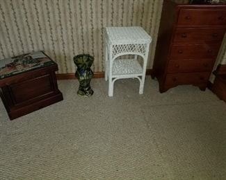 fabric top storage chest, wicker stand, small table with drawers