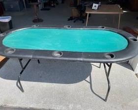 Padded Folding Craps / Poker Table measuring 30 tall x 72 wide x 36 deep. There is minor fabric damage that can be seen in the pictures.