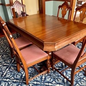 Delightful Antique Dining Table and 6 Chairs purchased from The Mill Antiques. This gorgeous table is accompanied by 2 leaves that measure 12" wide. The table measures 60x40x31 without the leaves inserted. There are some chips to the ornate wood and there is wear to the base. 