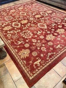 "Marinella Forbidden Red" Area Rug made in India measures 95x127 inches. This rug is in very good condition with light wear. 