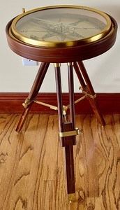 Nautical Compass Table measures 24 inches tall and is 14 inches in diameter. 