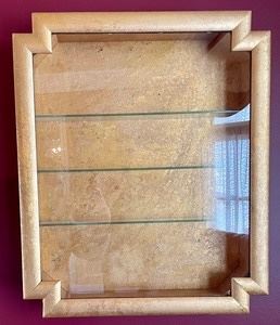 Gorgeous Golden Display Case with Glass Shelves measuring 20.5x24.5x4 inches. This is a beautiful piece, the gold finish is truly gorgeous! It was previously used to showcase a wonderful Limoges collection. 