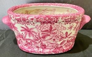 This pretty pink Asian planter measures 5x11x6.5 inches and is in good condition with light wear
