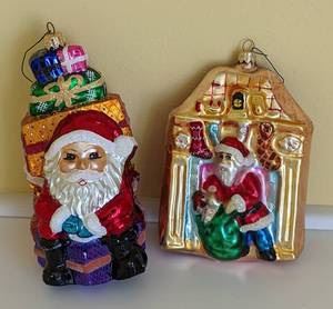 Pair of Large Christopher Radko Santa Ornaments. Both look to be in excellent condition. The largest measures 6” high and 4” wide.
