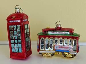 Blown Glass Phone Booth and Cable Car Ornaments. Both are in excellent condition. The cable car measures 5” wide and 4” high.
