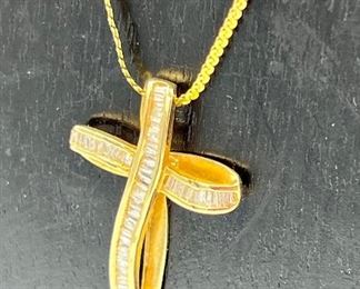 14k Gold Baguette Diamond Chain and Cross Pendant. The chain measures 17” and the cross pendant is 1” 